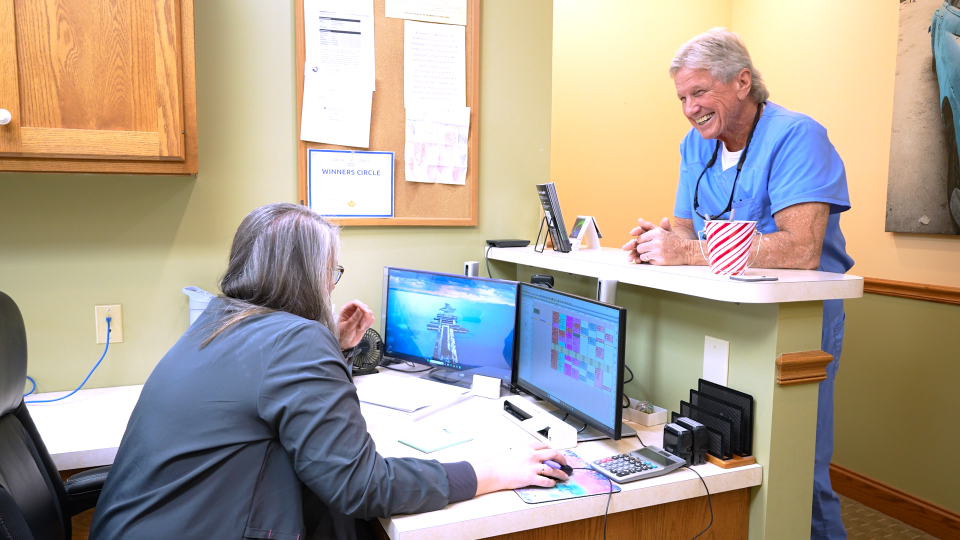 Dr. Mark Haring sharing a smile with a team member at the practice